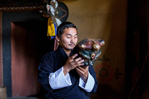 Buthanese man with traditional mask for fire festival in Thangbi stock photo