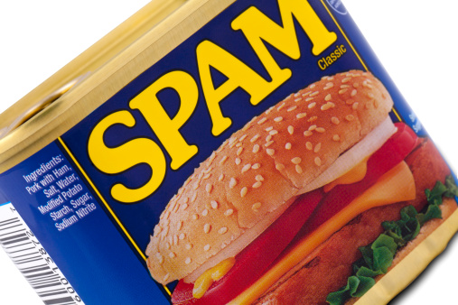 Galloway, New Jersey, USA - April 14, 2011: A can of spam, isolated on a white background.Spam that is sold in North America, South America, and Australia is produced in Austin, Minnesota, also known as Spam Town USA and in Fremont, Nebraska.  SPAM is made up of \