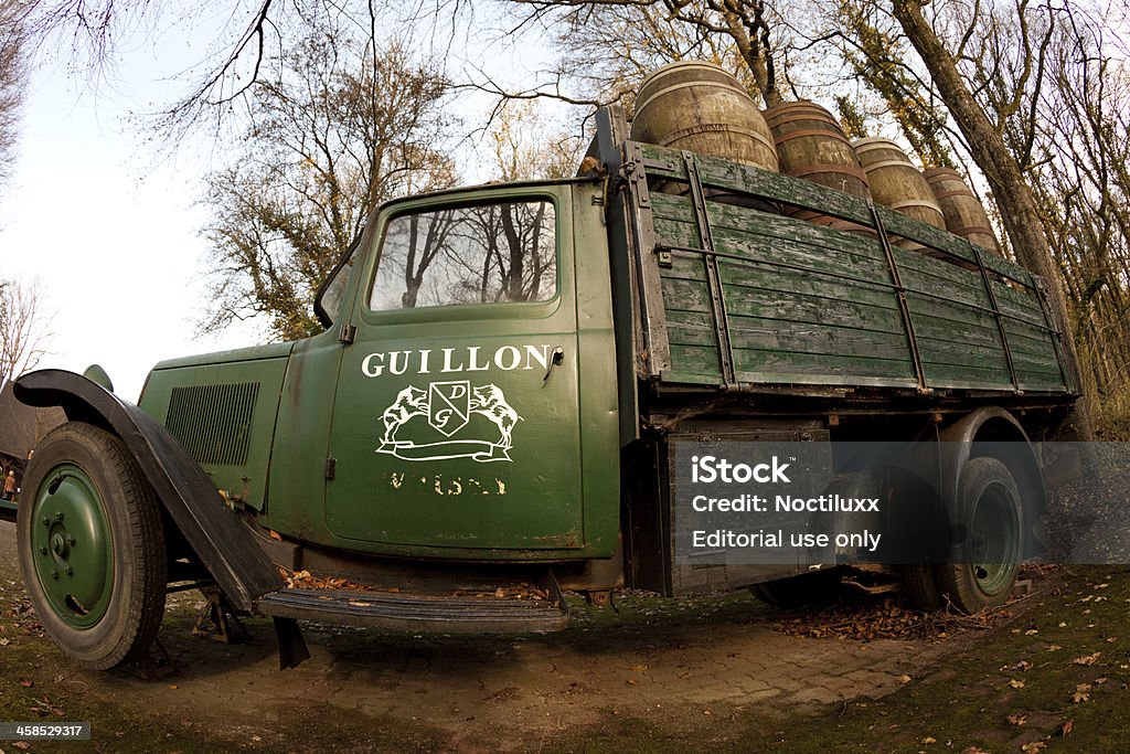 Antique Guillon truck carrying whiskey barrels LOUVOIS, FRANCE - November 20, 2010: Antique truck carrying whiskey barrels at the Guillon whiskey distillery based in the French Champagne region. Woodland Stock Photo