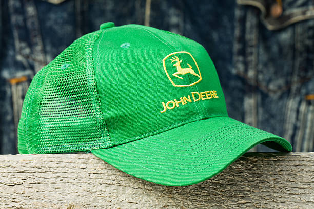 John Deere Cap On Wood Block Stock Photo - Download Image Now