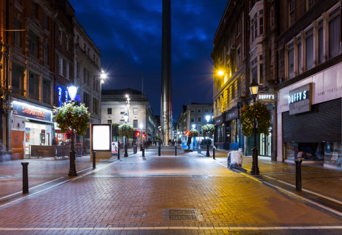 Dublin, Ireland - October 14, 2013: The view of Talbot street in Dublin city center at dusk. The Spire monument can be seen in the distance.