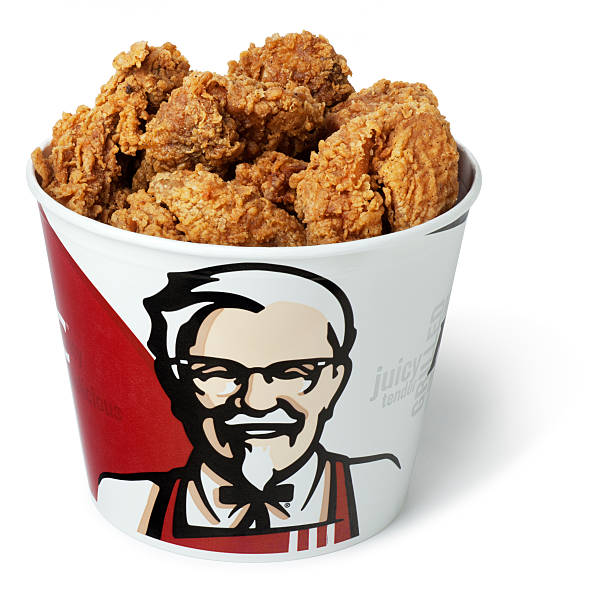 Bucket of Kentucky Fried Chicken San Diego, California, United States - April 13th 2011: This is a photo of a bucket of Kentucky Fried Chicken on a white background. The original recipe for KFC is a trade secret and there is only one handwritten copy kept in a vault at corporate headquarters. KFC Chicken stock pictures, royalty-free photos & images