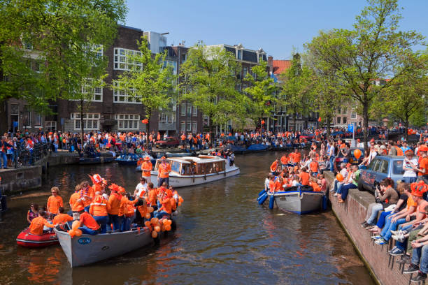 Queensday celebrations on the Prinsengracht canal in Amsterdam stock photo