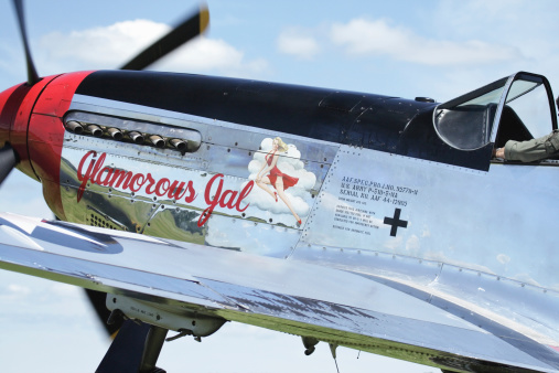 Geneseo, New York, USA - July 12, 2009: The Glamorous Gal, a P-51D Mustang WWII vintage military airplane waiting to take off at the Geneseo Military Air Show.