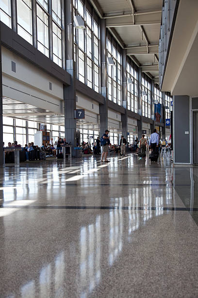 Austin Bergstrom Airport interior Austin, Texas, USA - May 5, 2011: Austin-Bergstrom International Airport (AUS). With normal noon time activity in the main walkway that connects the airline gates. austin airport stock pictures, royalty-free photos & images