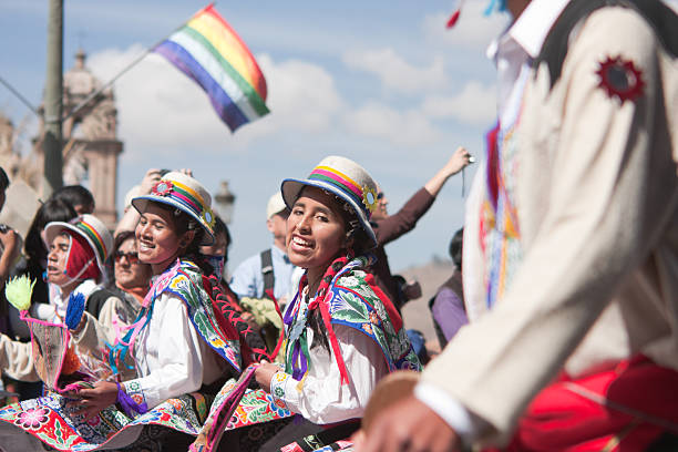 Young Women Dancing during Cusco Parade Cusco, Peru - June 19, 2010: Young women wearing elaborate Peruvian costumes perform a Peruvian dance during the day time parades which are part of the week long festivities of the Inti Raymi Festival. The parades are held in Plaza de Armas, Cuscos' main square. inti raymi stock pictures, royalty-free photos & images