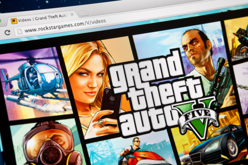 Moscow, Russia - September 23, 2013: Close up iMac screen with Grand Theft Auto V website in browser. Most popular video game, announcing the launch, on September 17 on PlayStation 3 and Xbox 360 consoles.