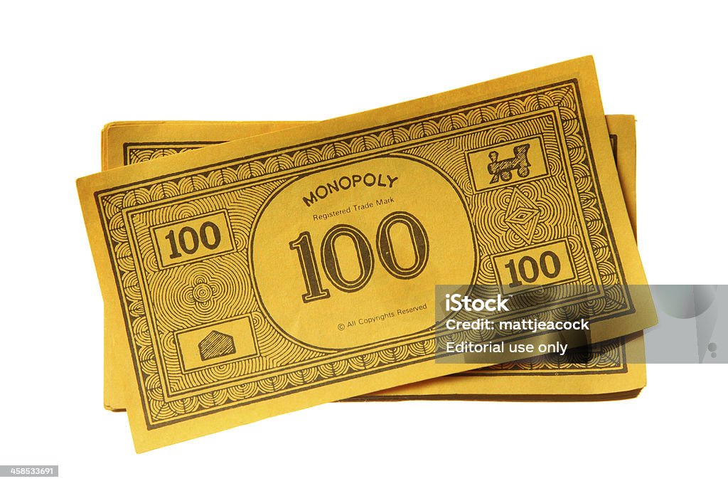 Monopoly game money London, United Kingdom - August 4, 2011: Monopoly game money. Monopoly is a board game named after the concept of dominating a market, a monopoly. Players take turns to move around a board buying property and paying and receiving rent. Monopoly Stock Photo