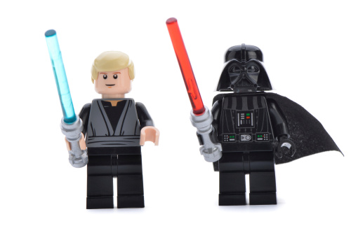 Ankara, Turkey - April 06, 2013: Close- up of a Lego Star Wars Darth Vader and Luke Skywalker with lightsaber swords isolated on white background.