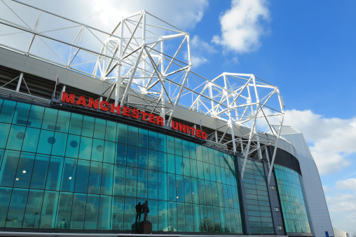 Manchester, England - March 1st, 2011: The east stand of Old Trafford football stadium, home of Manchester United. With space for 75,957 spectators, Old Trafford has the second-largest capacity of any English football stadium after Wembley Stadium.