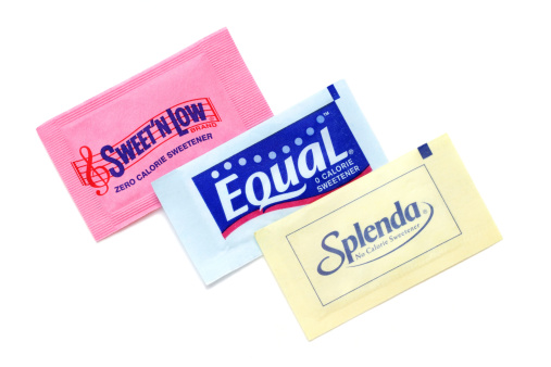 West Palm Beach, USA - April 12, 2011: Product shot of three different brands of zero calorie sweeteners: Sweet N Low in pink, Equal in blue, and Splenda in yellow. Each brand is an artificial sweetener used as a sugar substitute.