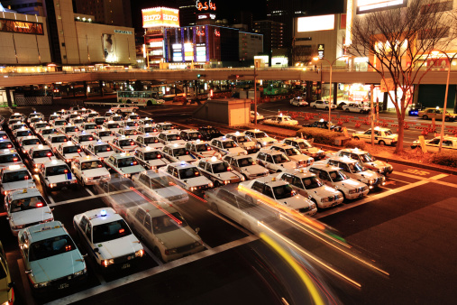 Sendai, Japan - January 8, 2011 : Hundreds of taxis serving Sendai Station at night, Japan. Sendai is the capital city of Miyagi Prefecture, Japan.