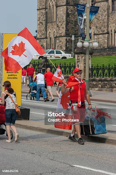 Street Vendor Walking On Canada Day Stock Photo - Download Image Now - 2013, Adult, Canada