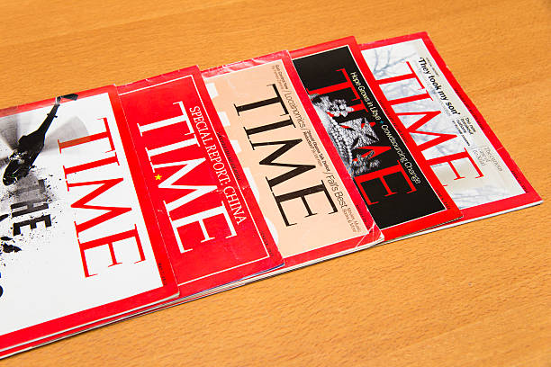 Time Magazine Shanghai, China - Oct 2, 2013: Time magazine displayed. Time is America's most popular magazine which introduces news to the public on a weekly basis. newspaper seller stock pictures, royalty-free photos & images