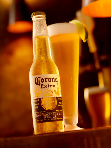 Calgary, Canada - April 5, 2011: Ice Cold Bottle and Glass of Corona Beer shot in a Bar Setting, Corona is a Mexican made Beer.