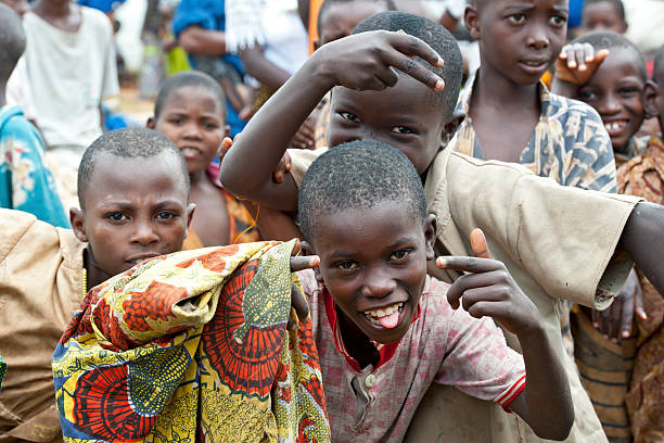 Nyanza-Lac, Burundi - December 31, 2010: A group of young african boys is fooling around in front of the camera and is having a good time together. Location: Shore of Tanganyika Lake in the town of Nyanza-Lac in Burundi, directly at the border to Tanzanania.