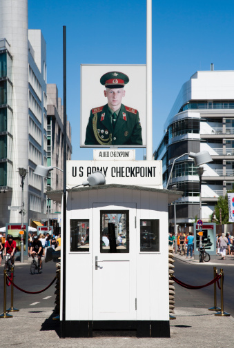 Berlin, Germany - July 21, 2013: Checkpoint Charlie; the most famous Berlin crossing point between East and West Berlin during the Cold War, July 21, 2013