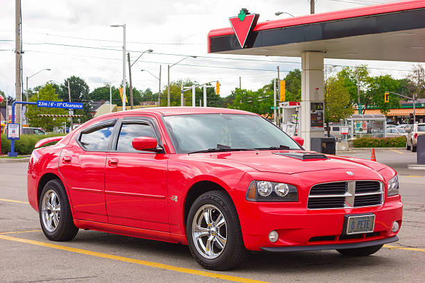 Hamilton, Canada - September 3, 2013: Red colored first generation Dodge Charger LX parked in a parking lot.