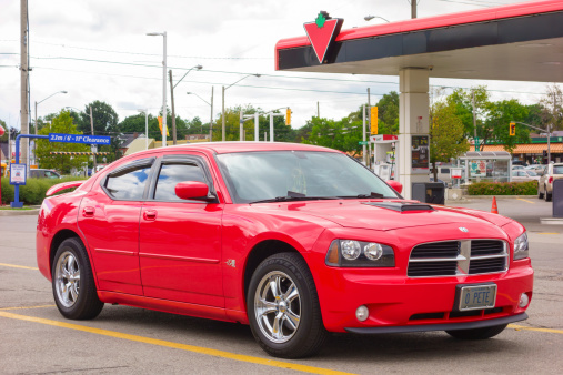 Hamilton, Canada - September 3, 2013: Red colored first generation Dodge Charger LX parked in a parking lot.