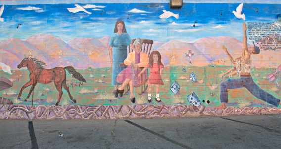 Alpine, Texas, USA- April 11, 2024: Downtown Alpine, Texas building with a local history mural.