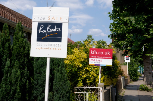 London, England - June 4, 2011: For Sale signs outside homes in Nunhead, South London. The area recently has been showing a big rise in people selling their homes with the financial downturn.