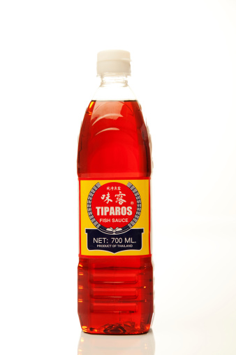 Colorado Springs, Colorado, USA - March 6th, 2011 A bottle of Tiparos Fish Sauce against white background. It is produced in Thailand.