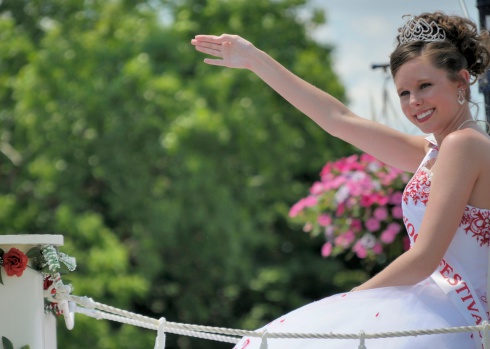 Frankenmuth, Michigan, USA - June 14, 2009: A local Beauty Queen waves to the crowd on a parade float during the Bavarian festival in Frankenmuth, Michigan. Frankenmuth is a Bavarian themed resort town with a rich German heritage that caters to visitors from around the world, especially families.