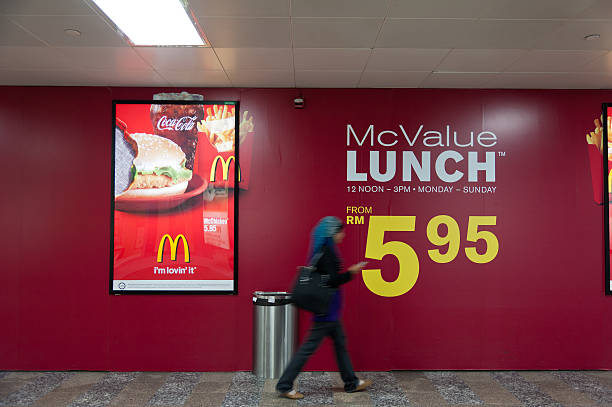 mcdonald's ad in stazione ferroviaria di kuala lumpur kuala lumpur - mcdonalds french fries branding sign ストックフォトと画像