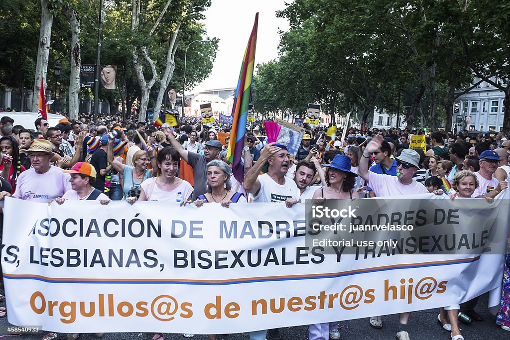 Demonstration at the Gay Pride parade in Madrid Madrid, Spain - July 6, 2013: People participating on a demonstration at the Gay Pride parade. Near 1,200,000 people from all over the world participated at the Gay Pride Parade in Madrid. Adult Stock Photo