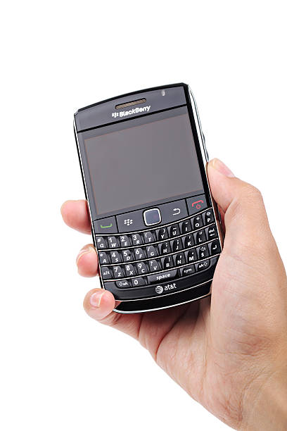 holding blackberry handy an den seiten - blackberry mobile phone smart phone human hand stock-fotos und bilder