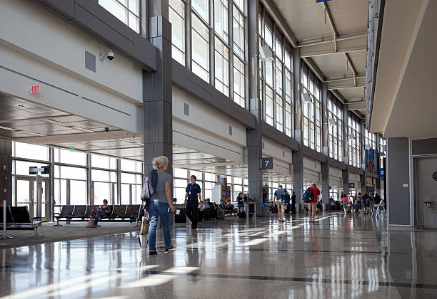 Austin Bergstrom Airport interior Austin, Texas, USA - May 5, 2011: Austin-Bergstrom International Airport (AUS). With normal noon time activiy in the main walkway that connects the airline gates. austin airport stock pictures, royalty-free photos & images