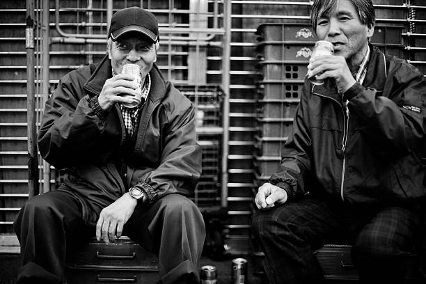 New Orleans, Louisiana, United States - March 31, 2011: Street performers talking during a break in the streets of French Quarter famous for its live performances, in New Orleans, Louisiana, United States.