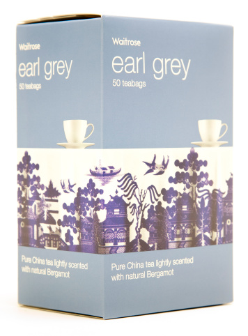 Yokohama,  Japan - February  18,  2011: Earl grey teabags pack with teacup and Willow Pattern design from Waitrose - an upmarket popular UK supermarket brand which is part of the John Lewis Partnership.Isolated on a white background