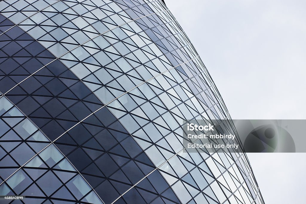 Gherkin skyscraper (Cucumber Building or the Swiss Re Building) London, United Kingdom - May 7, 2011: A part of modern Gherkin skyscraper (also named Cucumber Building or the Swiss Re Building) on 30 St Mary Axe, London's main financial district, the City of London. Build in December 2003, opened in May 2004. It has 40 floors and height of 180 m. Architecture Stock Photo