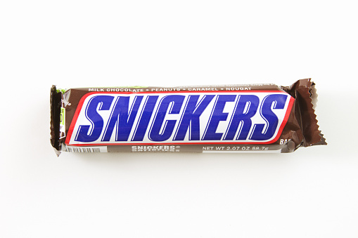 Liberty Township, Ohio, USA - February 14, 2012: A photo on white background of a Snickers candy bar made by Mars, Incorporated.