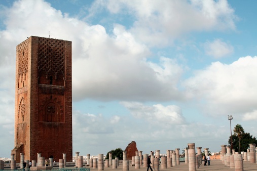 Rabat, Morocco - October 3, 2008: Some people walking among the columns beside the Hassan tower, the most important monument at the Moroccan Capital City.
