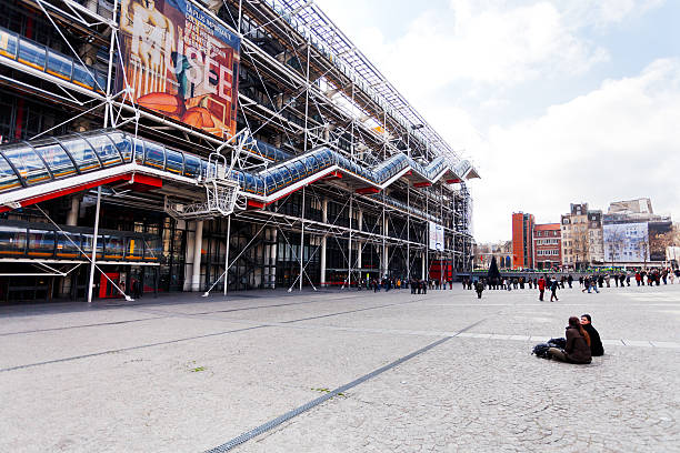 queue to pompidou centre, Paris, France - March 6, 2013: queue of tourists to Centre Georges Pompidou. The Centre the third most visited Paris attraction with about 5.5 million visitors per year, in Paris, France pompidou center stock pictures, royalty-free photos & images