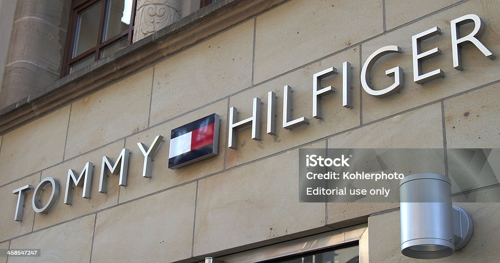 Tommy Hilfiger sign Nuremberg, Germany - April 23, 2011: Tommy Hilfiger sign on the official store in Nuremberg, Germany. Clothing Stock Photo