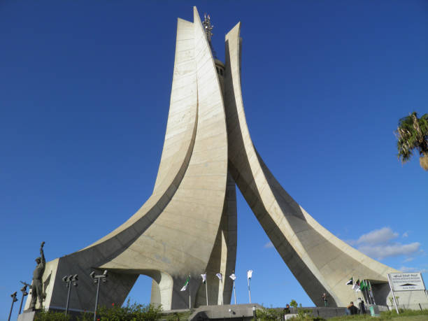 Algiers, Algeria - Oct 16, 2011: Martyrs' Memorial is an iconic concrete monument commemorating the Algerian war for independence. The monument was opened in 1982 on the 20th anniversary of Algeria's independence. It is fashioned in the shape of three standing palm leaves which shelter the \