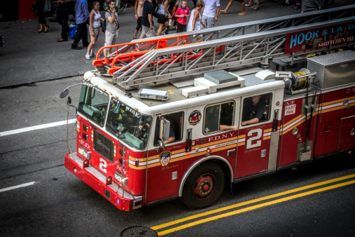 New York City, USA - August 7, 2012 : A fire truck is rushing on the W 42nd St near Times Square.