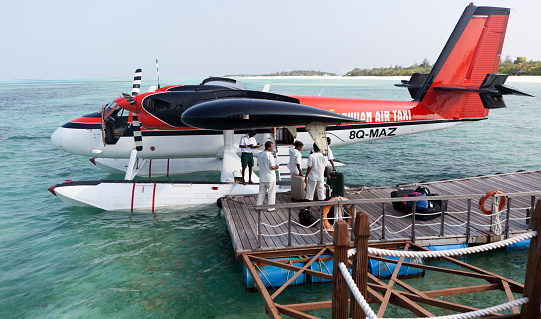Twin Motor Passenger Seaplane Landing in Calm Lagoon Waters - Republic of Maldives - Indian Ocean