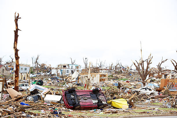 Joplin Missouri deadly F5 Tornado debris scattered Joplin, United States - May 25, 2011: Joplin Missouri deadly F5 Tornado debris scattered and auto in foreground only a few days following the storm deconstruct stock pictures, royalty-free photos & images