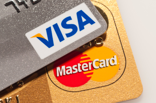 Caracas, Venezuela - July 22, 2011: Visa and Mastercard logos on platinum and golden credit cards