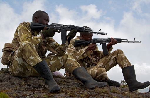 Aberdare Mountains, Kenya aa February 19, 2011: Two armed rangers posing with rifles in the Aberdare National Park, Kenya.
