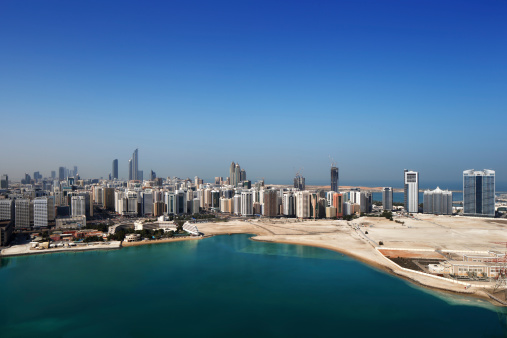 Abu Dhabi, UAE - March 1, 2013: A skyline view of Abu Dhabi, UAE.  Abu Dhabi is UAE's 2nd largest city and has a population of almost 1 million residents