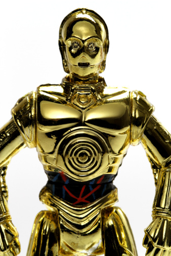 Vancouver, Canada - May 15, 2011: C3PO, from the Hasbro line of Star Wars toys, isolated against a white background.