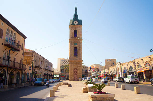 Jaffa, Isreal. - September 15, 2013: A view of Jaffa Street and famous clock tower which is one of seven clock towers built in Israel during the Ottoman period. This tower was built in honor of Sultan Abd al-Hamid II.