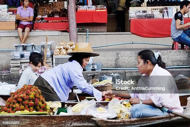 Lady Selling Food From Boat On Floating Market In Thailand Stock Photo - Download Image Now