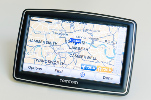 Florence, Italy - March 18, 2011: XXL TomTom on the table showing the roads map of London . TomTom International BV is a Dutch company that makes satellite navigation systems for automobiles, motorcycles, handhelds and smartphones. Each system has a processor and a touch screen. TomTom is the leading supplier of navigation systems in Europe with offices around the world. The model of TomTom is XXL Europe version with 5 inch screen.