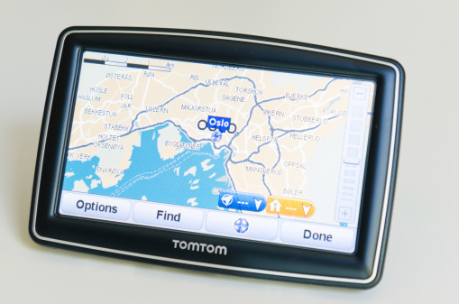 Florence, Italy - March 18, 2011: XXL TomTom on the table showing the roads map of Oslo . TomTom International BV is a Dutch company that makes satellite navigation systems for automobiles, motorcycles, handhelds and smartphones. Each system has a processor and a touch screen. TomTom is the leading supplier of navigation systems in Europe with offices around the world. The model of TomTom is XXL Europe version with 5 inch screen.